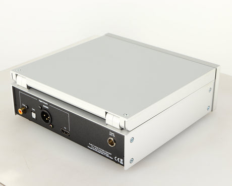 Rear left corner of a used Project CD Box RS2 T CD Transport in a silver finish