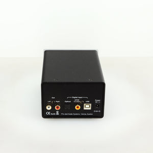 Rear view of a used Project DAC Box DS in a silver finish showing Phono Outputs, Optical Input, USB Input and Power Input