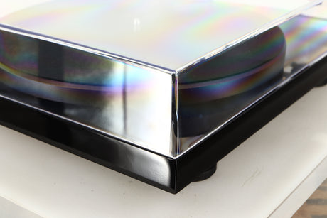 Front left corner of a used Project Debut Carbon Evo DC Turntable in a black finish