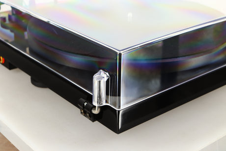 Rear left corner of a used Project Debut Carbon Evo DC Turntable in a black finish