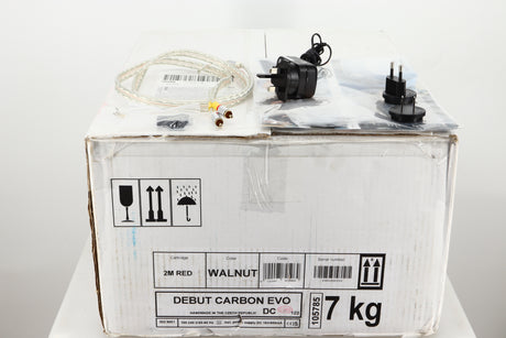 Box for a used Project Debut Carbon Evo Turntable / Ortofon 2M Bronze Cartridge showing Power Supply, Interconnect Cable, Manual, Spare Belt and Schuko Plugs