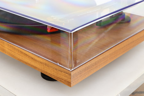 Front right corner of a used Project Debut Carbon Evo Turntable / Ortofon 2M Bronze Cartridge in a walnut finish