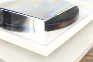 Front left corner of a used Project Debut Carbon Turntable / Ortofon 2M Blue Cartridge in a white finish