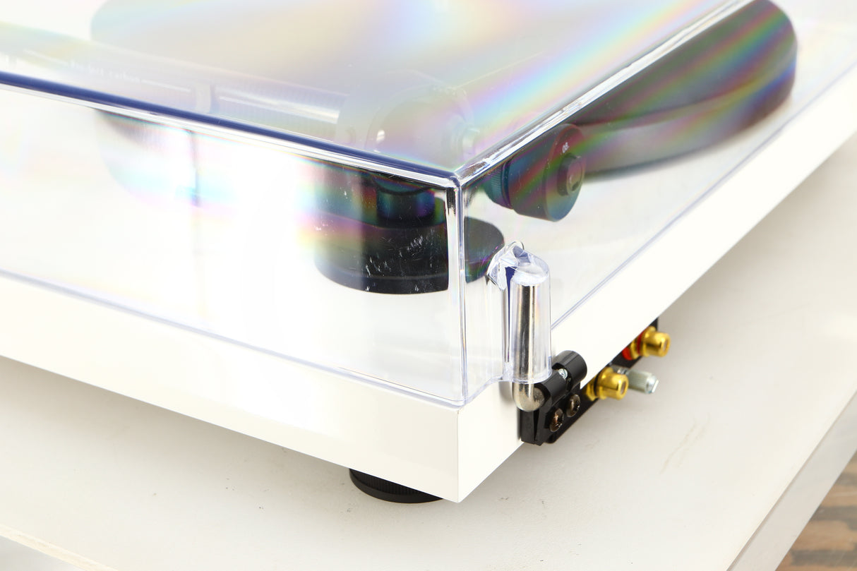 Rear right corner of a used Project Debut Carbon Turntable / Ortofon 2M Blue Cartridge in a white finish