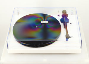Top of a used Project Debut Carbon Turntable / Ortofon 2M Blue Cartridge in a white finish