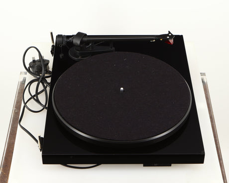 Left side view of a used Project Debut Carbon Turntable in a piano black finish