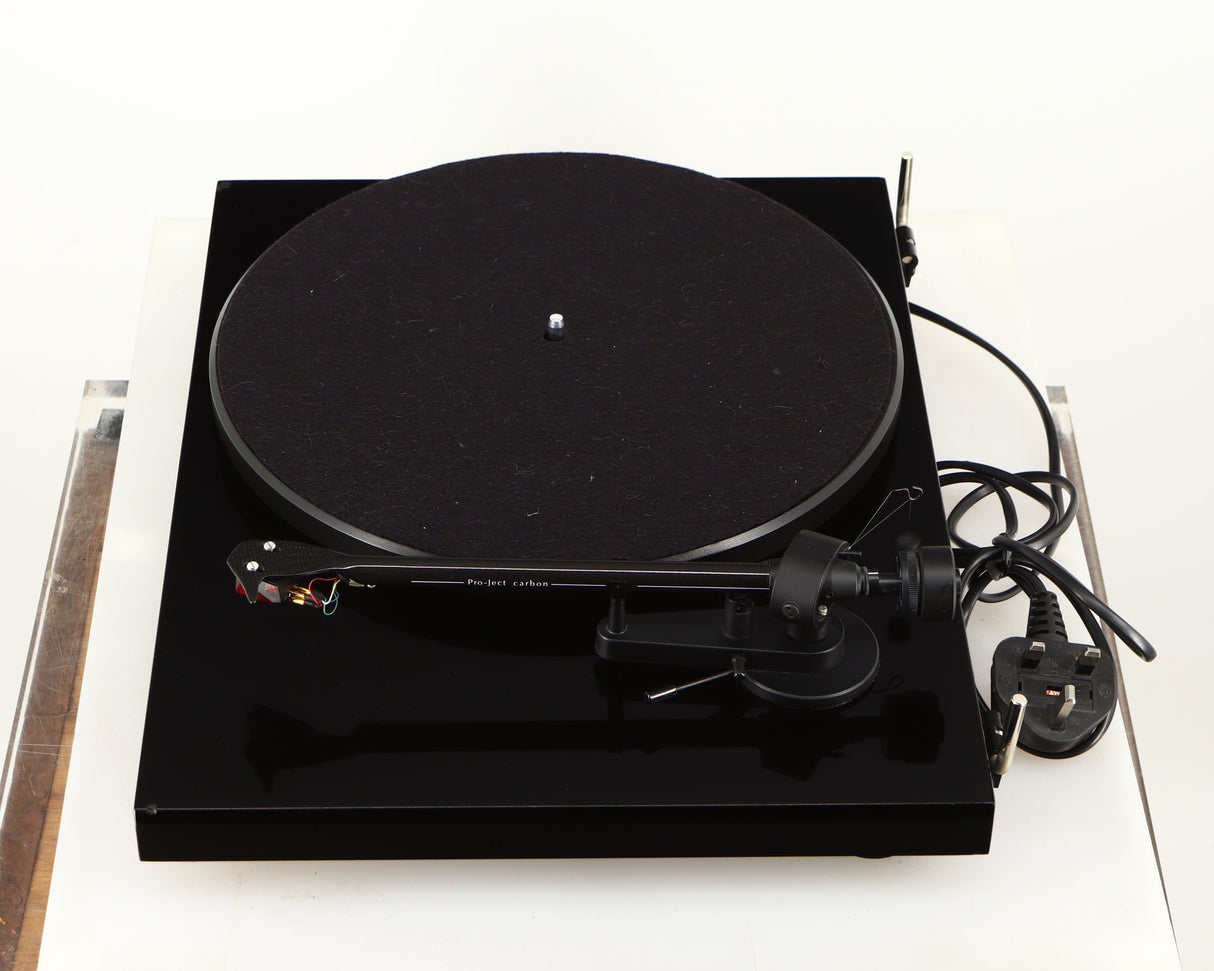 Right side view of a used Project Debut Carbon Turntable in a piano black finish