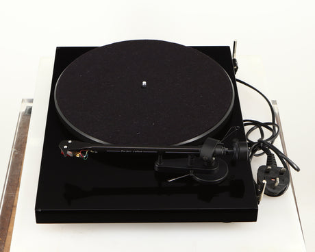 Right side view of a used Project Debut Carbon Turntable in a piano black finish
