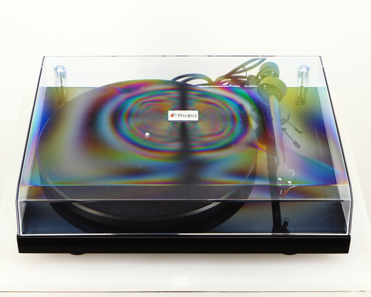 Top of a used Project Debut Carbon Turntable in a piano black finish