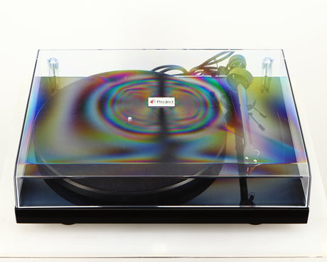 Top of a used Project Debut Carbon Turntable in a piano black finish
