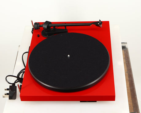 Left side view of a used Project Debut Carbon Turntable in a red finish