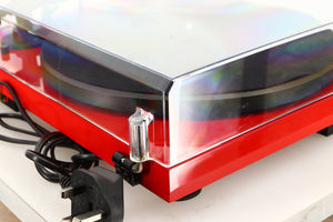 Rear left corner of a used Project Debut Carbon Turntable in a red finish