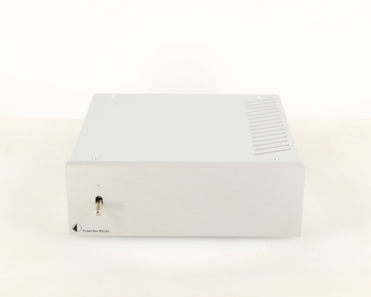 Front view of a used Project Power Box RS Uni-1-Way Power Supply in a silver finish