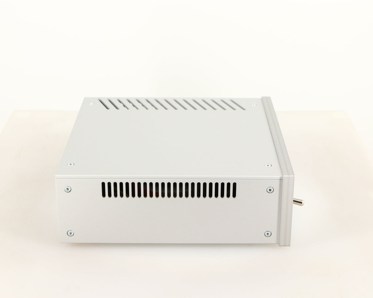 Left side view of a used Project Power Box RS Uni-1-Way Power Supply in a silver finish