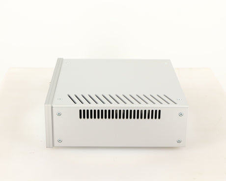 Right side view of a used Project Power Box RS Uni-1-Way Power Supply in a silver finish