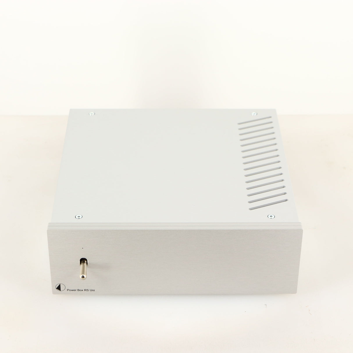 Top of a used Project Power Box RS Uni-1-Way Power Supply in a silver finish