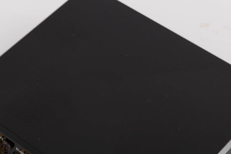 Close up of a used Project Record Box E Phonostage in a Black finish showing scratching on top