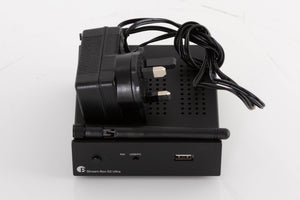 Top of a used Project Streambox S2 Ultra Network Streamer in a Black finish showing PSU and Wi-Fi Aerial