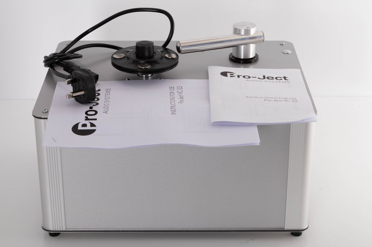 Top of a used Project VC-S3 Record Cleaning Machine in a Silver finish showing Manual and Mains Cable