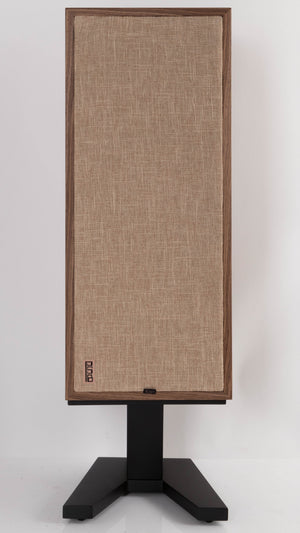 Front view of a used PSB Passif-50 Anniversary Edition Standmount Speaker in a Walnut finish showing Grille