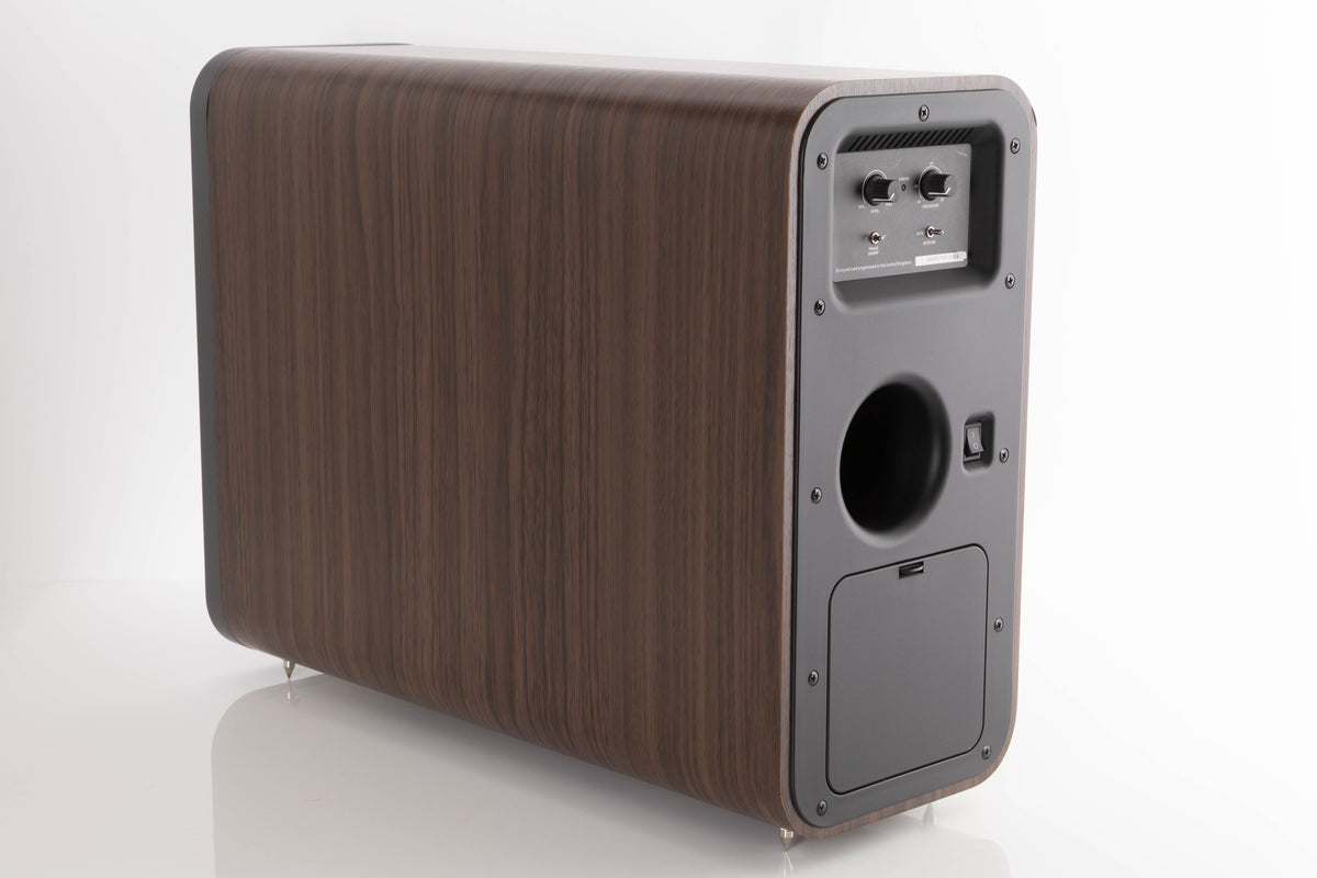 Rear right corner of a used Q Acoustics 3070S Subwoofer in a American Walnut finish