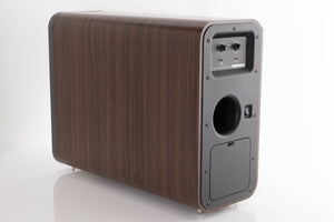 Rear right corner of a used Q Acoustics 3070S Subwoofer in a American Walnut finish