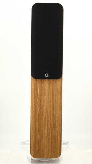 Front view of a used Q Acoustics 5050 Floorstanding Speaker in an oak finish showing Grille