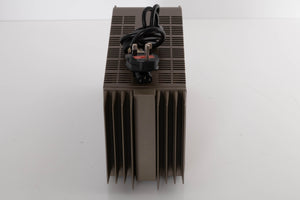 Top of a used Quad 303 Power Amplifier showing Mains Cable