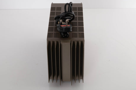 Top of a used Quad 303 Power Amplifier showing Mains Cable