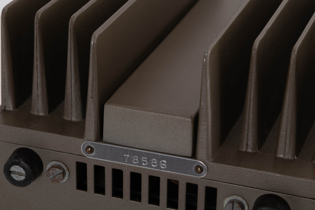 Close up of a used Quad 303 Power Amplifier showing serial number
