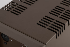 Close up of a used Quad 303 Power Amplifier showing scratching on rear edge