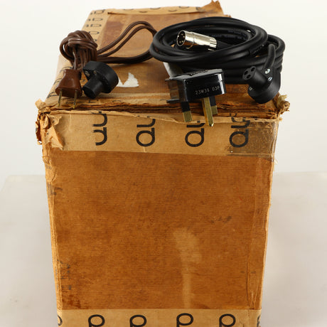 Box for a used Quad 303 Power Amplifier showing Power Cable and DIN Cable
