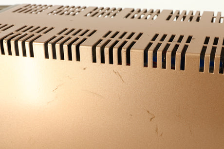 Close up of a used Quad 303 Power Amplifier showing some marks on right side
