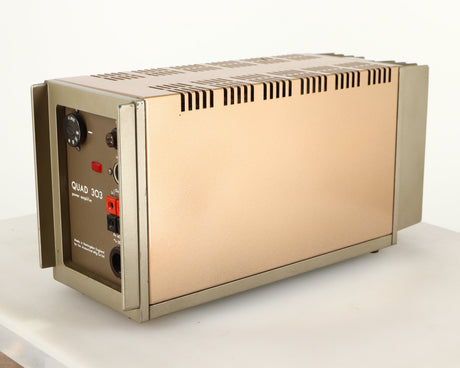 Rear left corner of a used Quad 303 Power Amplifier