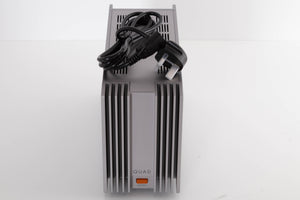 Top of a used Quad 303 Power Amplifier in a Silver finish showing Mains Cable