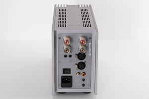 Rear view of a used Quad 303 Power Amplifier in a Silver finish showing Mains Input, Phono Inputs, XLR Inputs and Speaker Inputs