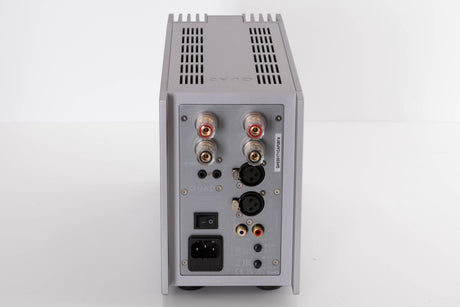 Rear view of a used Quad 303 Power Amplifier in a Silver finish showing Mains Input, Phono Inputs, XLR Inputs and Speaker Inputs