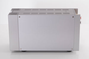 Right side view of a used Quad 303 Power Amplifier in a Silver finish
