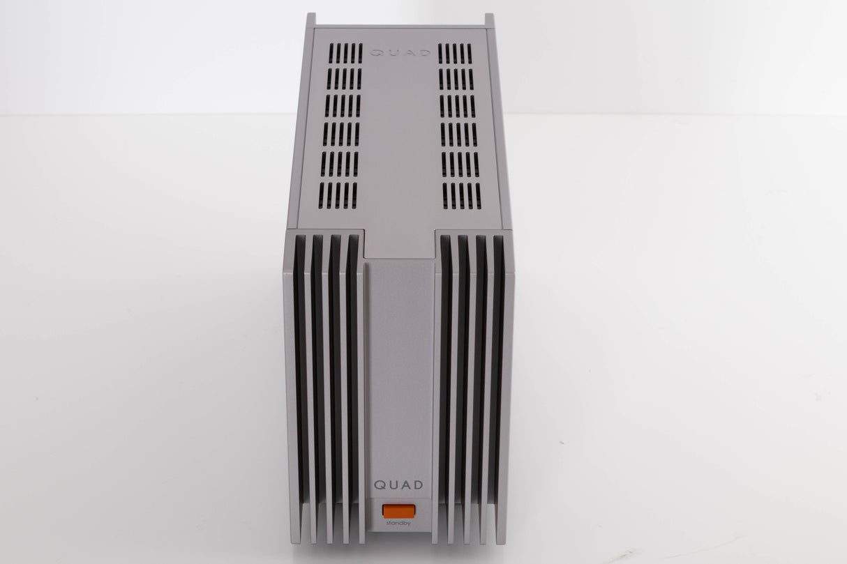 Top of a used Quad 303 Power Amplifier in a Silver finish