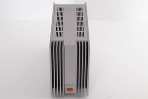 Top of a used Quad 303 Power Amplifier in a Silver finish