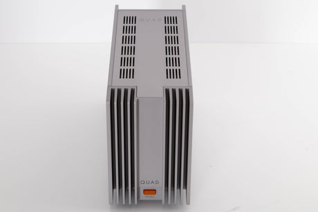 Top of a used Quad 303 Power Amplifier in a Silver finish