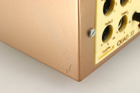 Close up of a used Quad 33 Pre Amplifier showing damage on rear right corner
