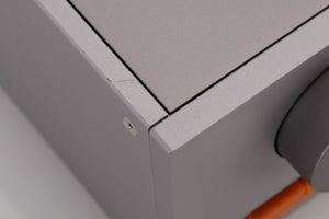 Close up of a used Quad 33 Pre Amplifier in a Silver finish showing light scratch on left side edge