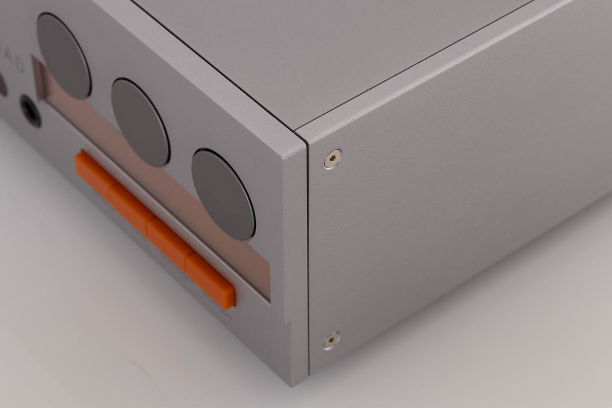 Front right corner of a used Quad 33 Pre Amplifier in a Silver finish