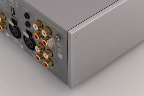 Rear left corner of a used Quad 33 Pre Amplifier in a Silver finish
