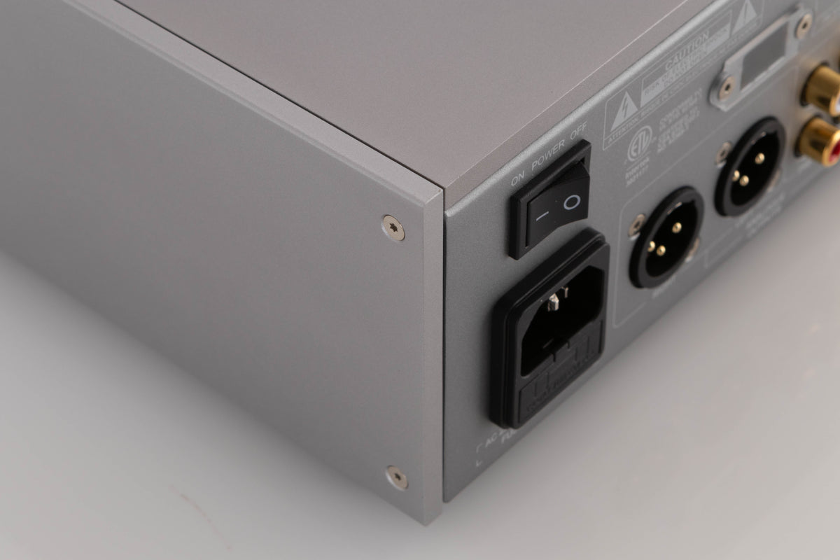 Rear right corner of a used Quad 33 Pre Amplifier in a Silver finish