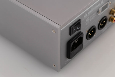 Rear right corner of a used Quad 33 Pre Amplifier in a Silver finish