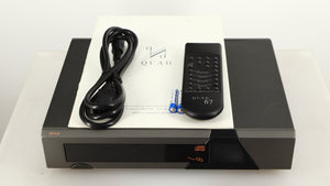 Top of a used Quad 67 CD Player showing Mains Cable, Remote, Batteries and Manual