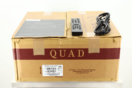 Box of Quad Artera Pre Amplifier showing manual, remote, and mains cable