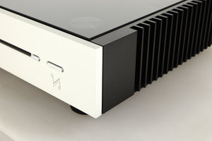 Front right corner view of a used Quad Artera Solus Integrated System in Silver finish